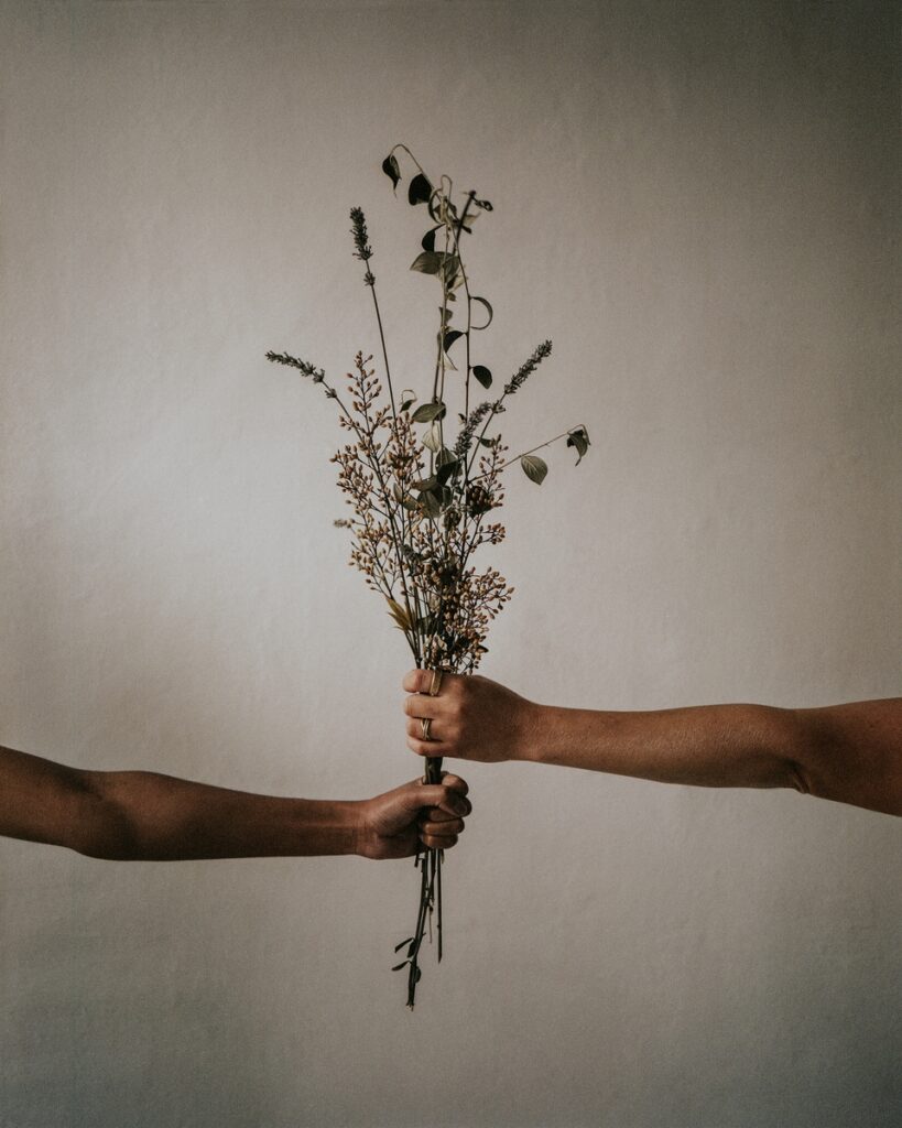 aesthetic hands with flowers, beige background